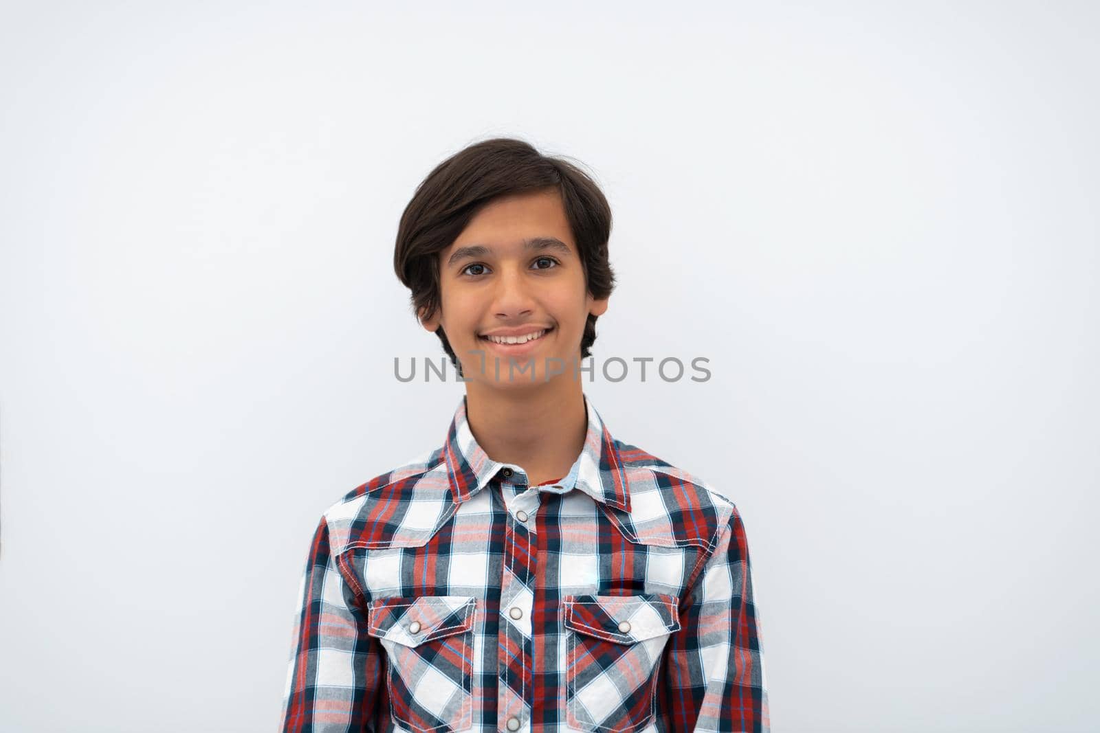 a portrait of a young attractive Arab boy isolated on a white background by dotshock