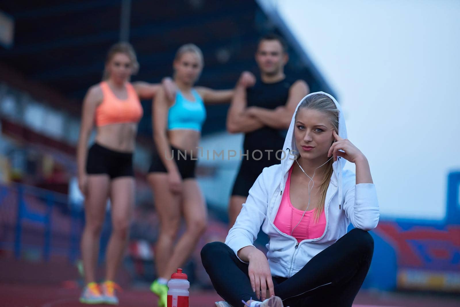 sporty woman on athletic race track by dotshock