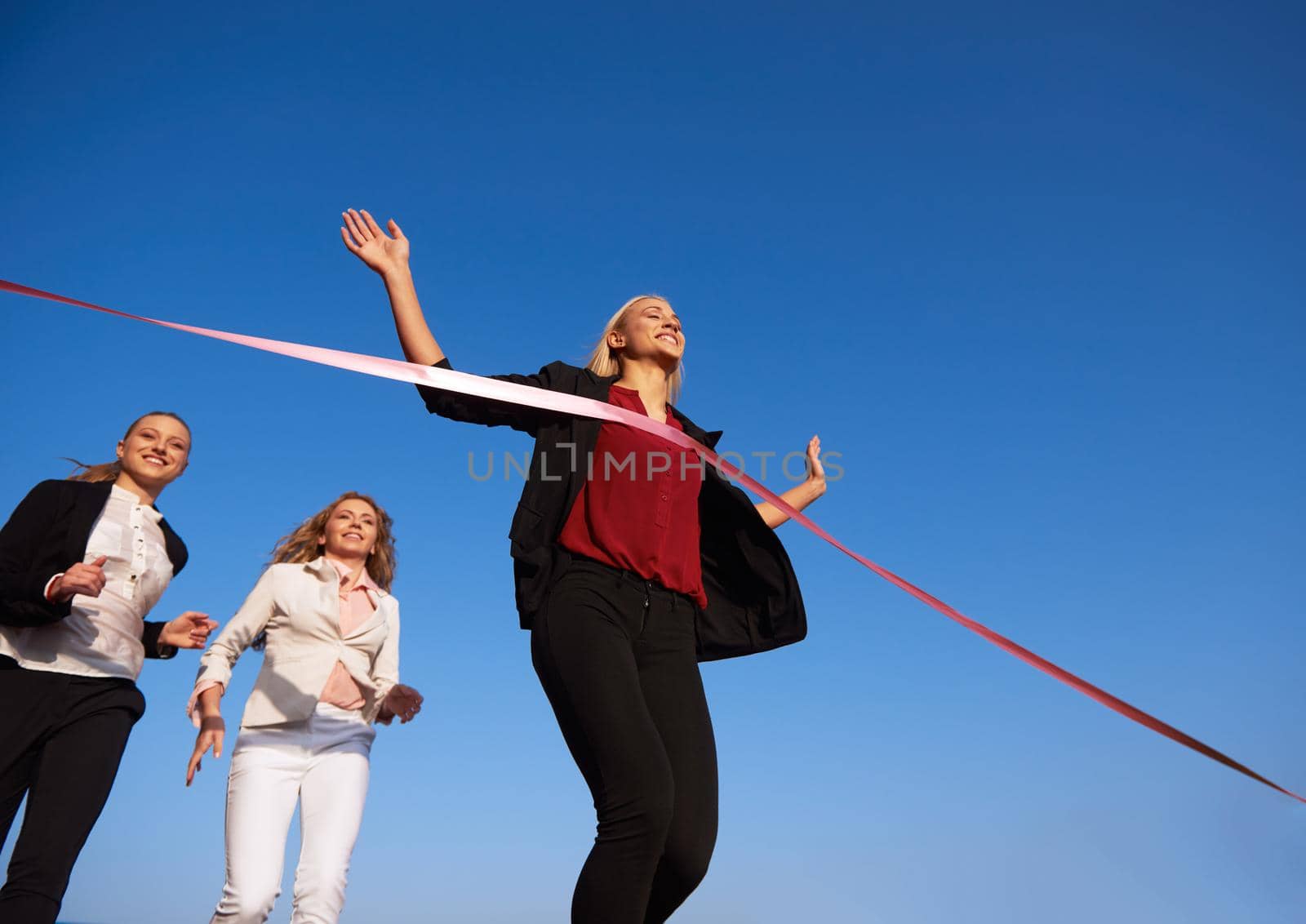 business people running on racing track by dotshock