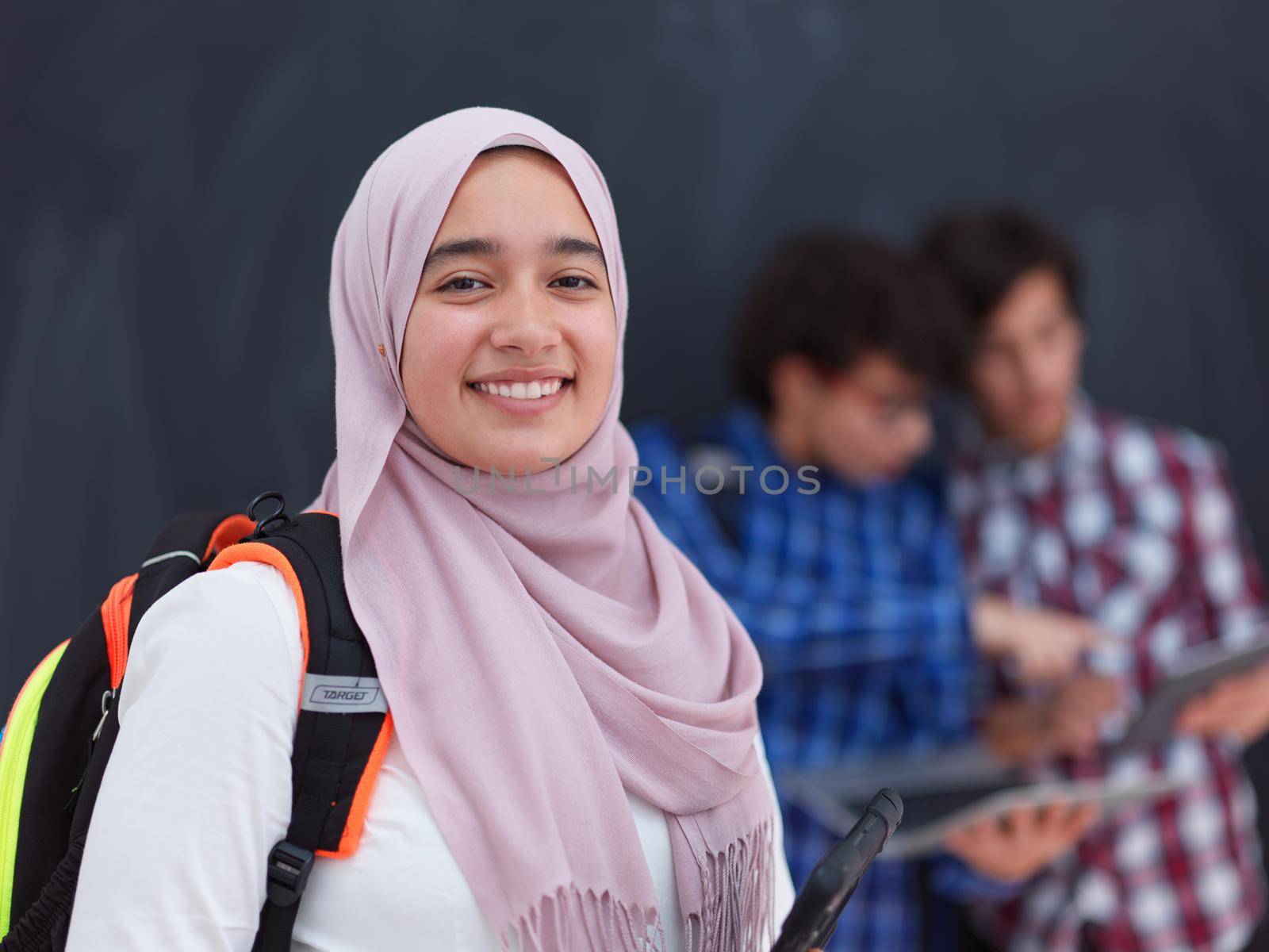 Arabic teenagers team, students group working together on laptop and tablet computer  online classroom education concept