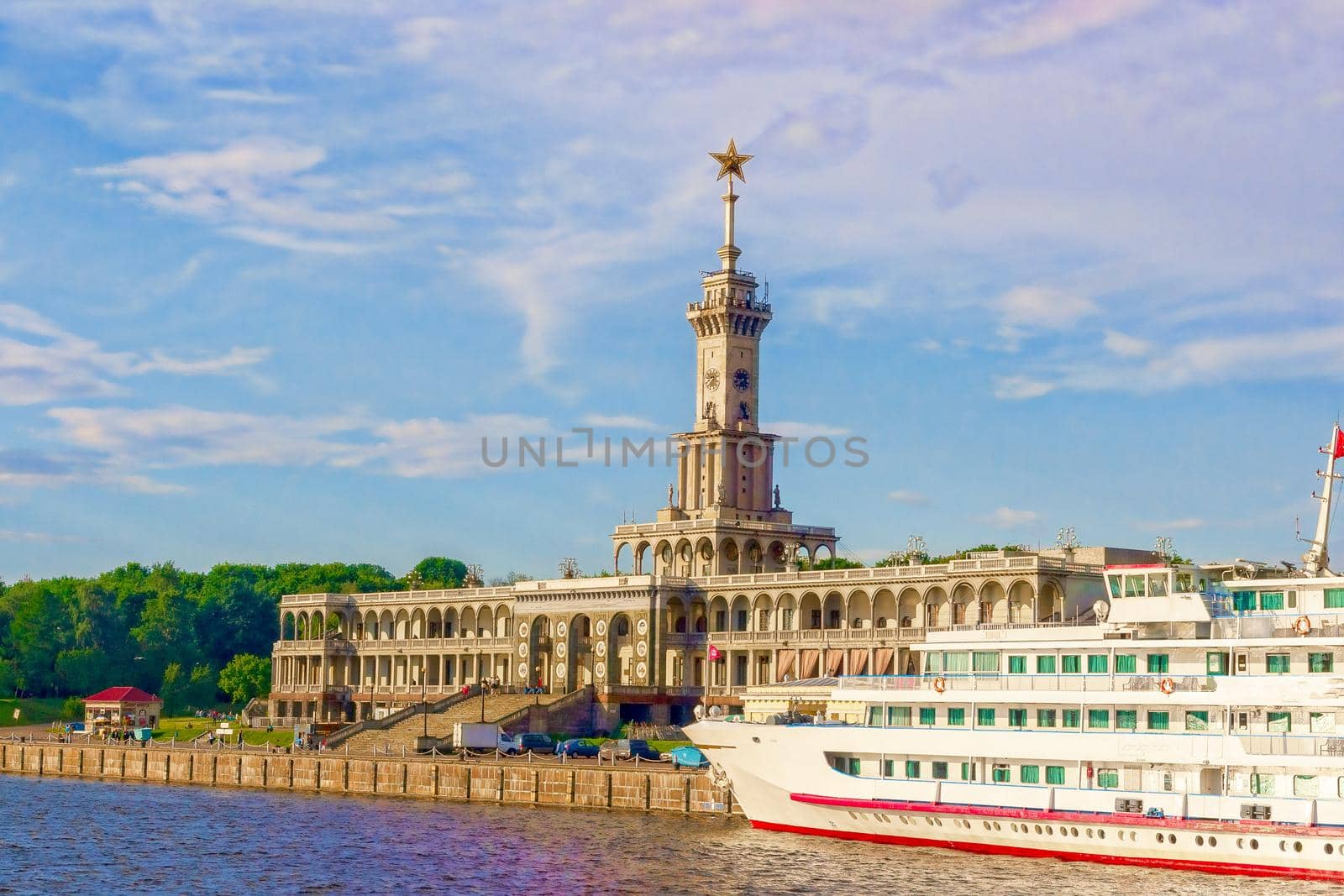 Tourist, passenger cruise liner moored at the pier of the river go station. The architecture of the Stalin era. The concept of tourism, summer holidays with the whole family. Russia Moscow.