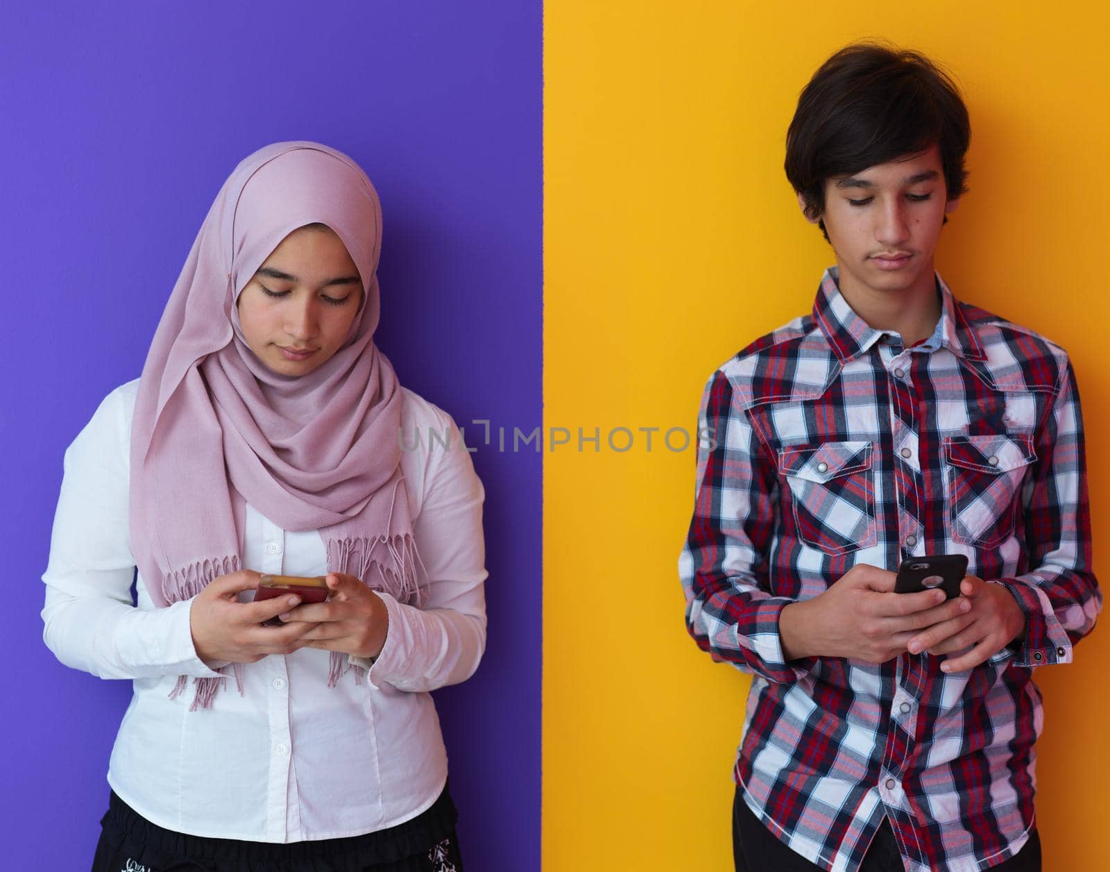 arab teenagers group using smart phones for social media networking and sharing of informations for online education