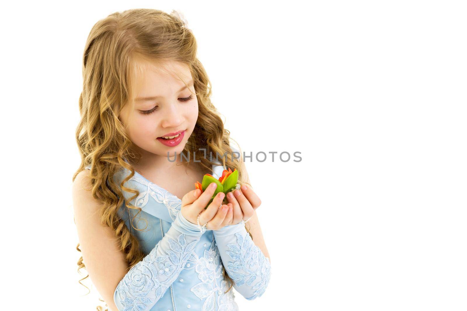 Charming little girl princess in a beautiful dress. The concept of a happy childhood, holidays. Close-up. Isolated on white.