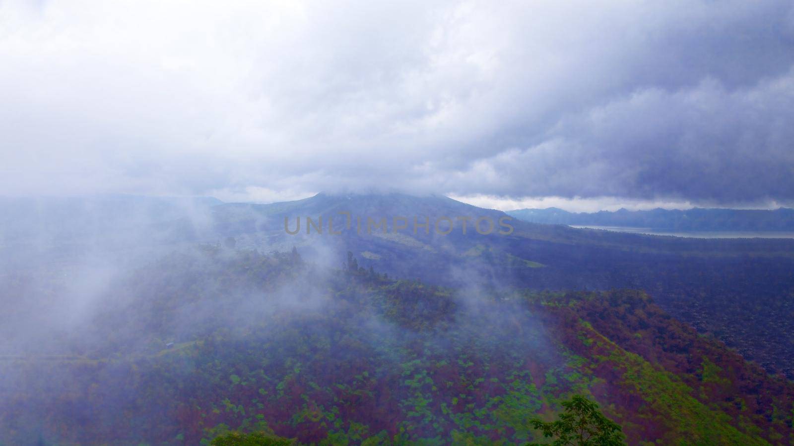 An old extinct volcano among the clouds and fog in the middle of the jungle. Mexico. Concept of wildlife, eco-tourism.