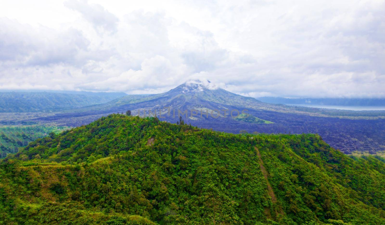 An old extinct volcano among the clouds and fog in the middle of the jungle. Mexico. Concept of wildlife, eco-tourism.