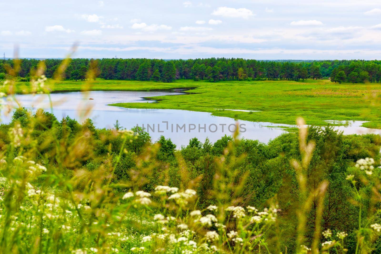 View of the traveler from the shore to the river in Vetluga. Kostroma region. Russia. The concept of tourism, Summer holidays with the whole family.