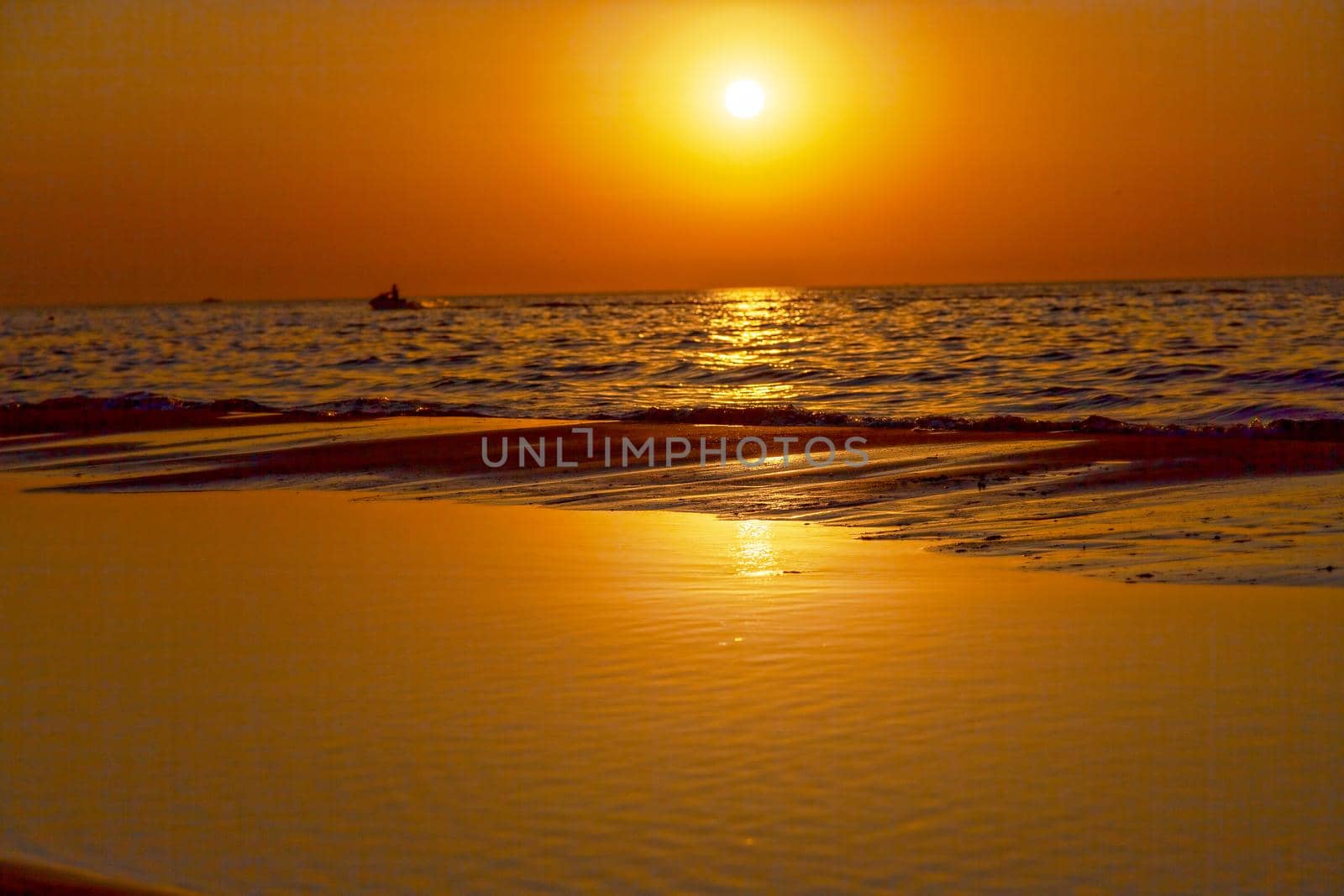 Warm, amazing sea wave close up on the beach sunrise like a sunset, nature landscape background.