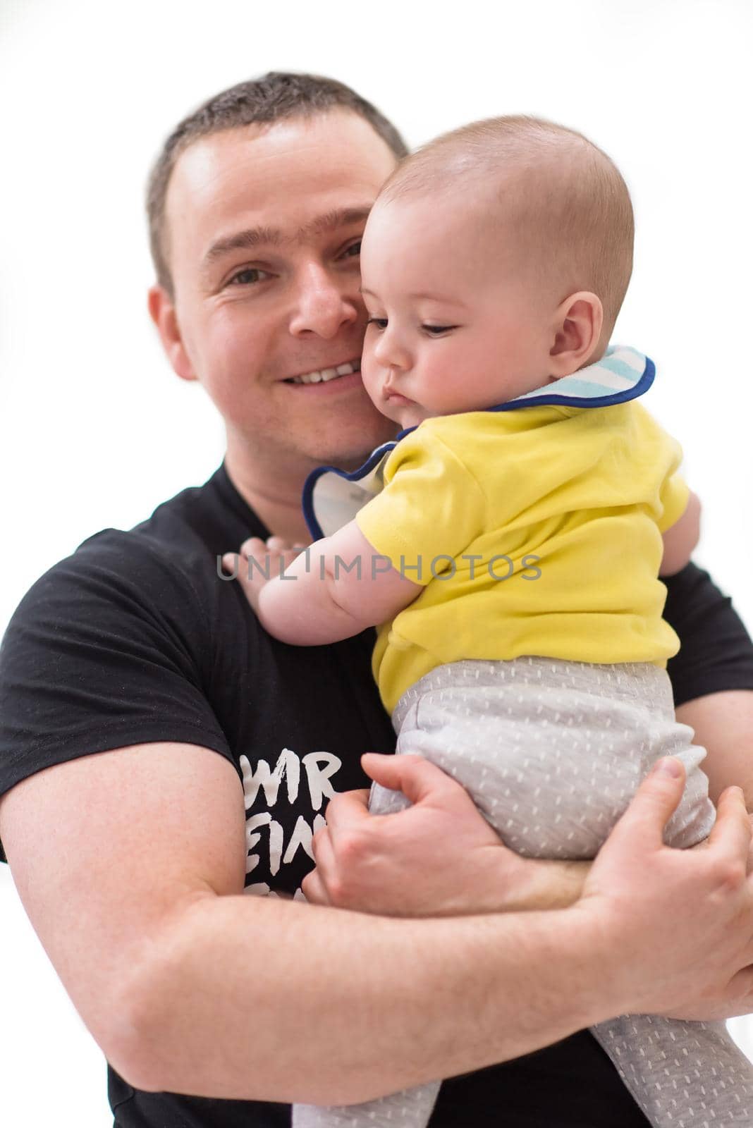 portrait of happy young father holding newborn baby boy isolated on a white background