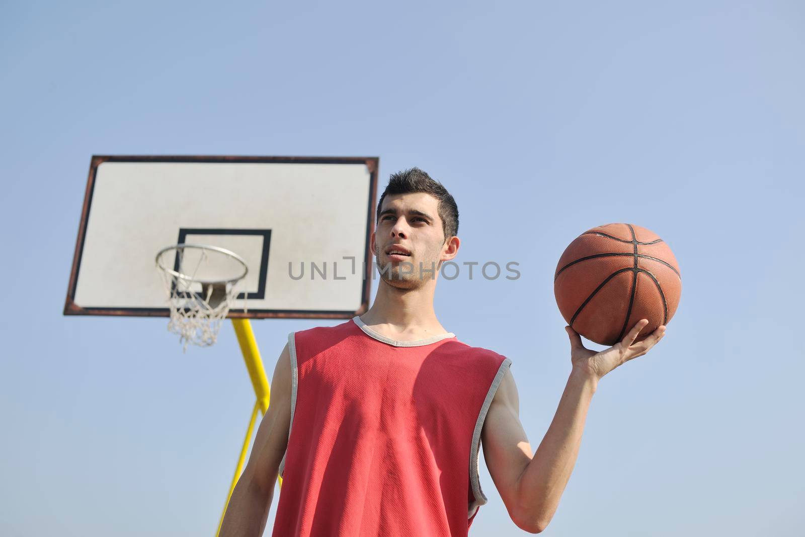 basketball player practicing and posing for basketball and sports athlete concept