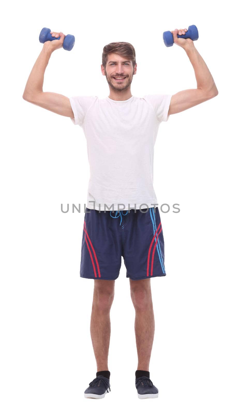 in full growth.young man with dumbbells.isolated on white background