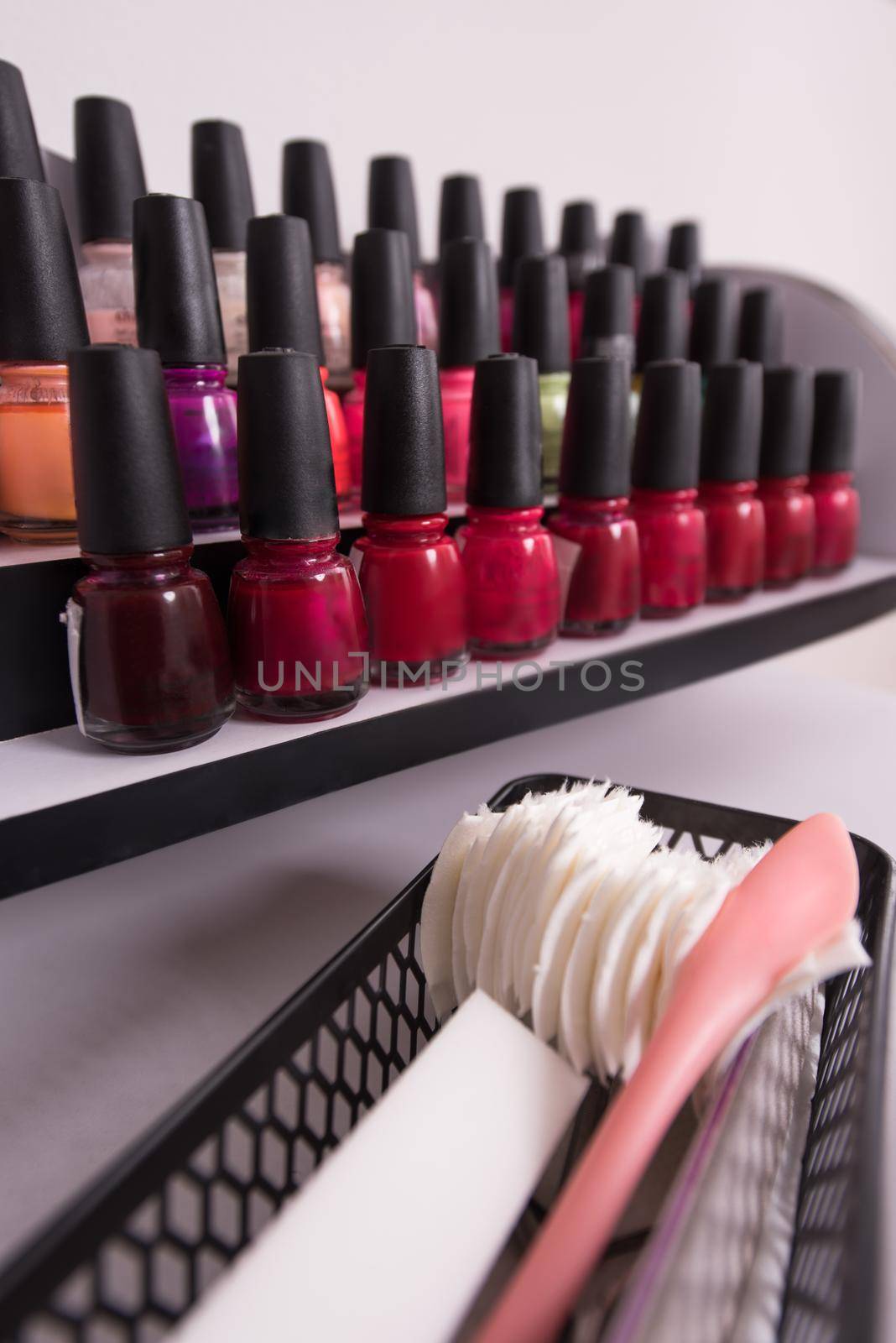 Set of different bottles of nail polish by dotshock