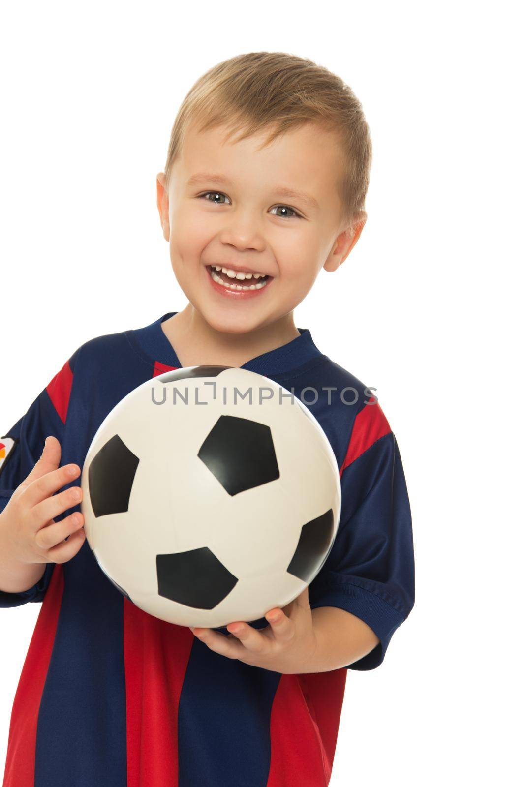 Portrait of a cheerful little boy football player in a striped uniform. The boy holds a hand soccer ball. Close-up - Isolated on white background