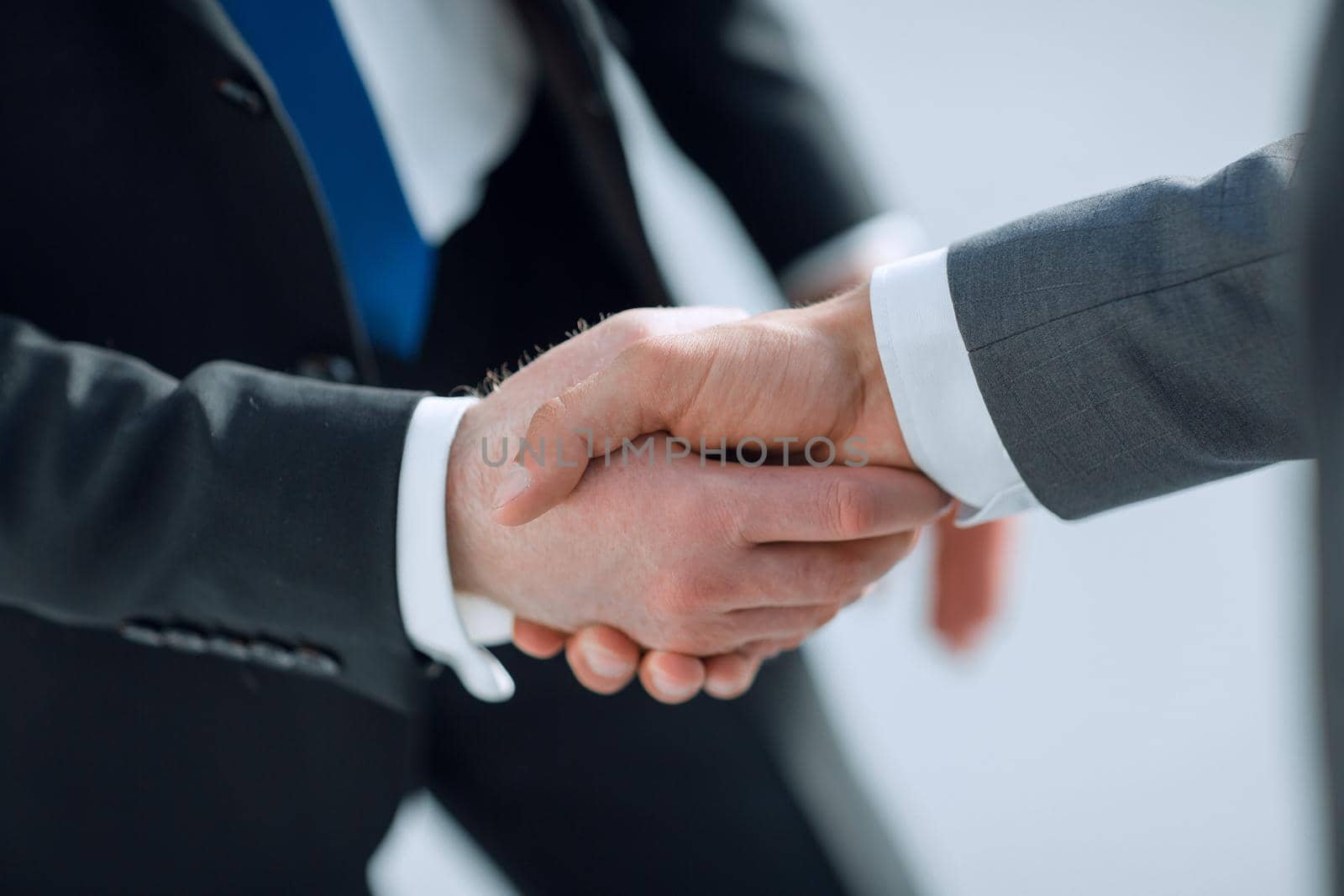 close up.reliable handshake of business partners.the concept of cooperation