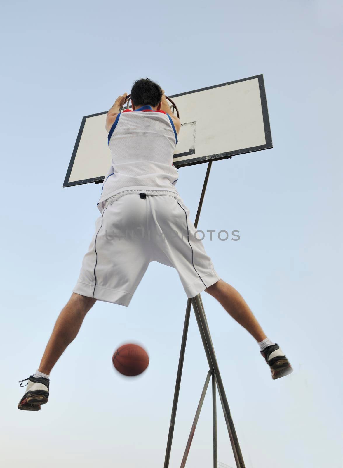 basketball player practicing and posing for basketball and sports athlete concept