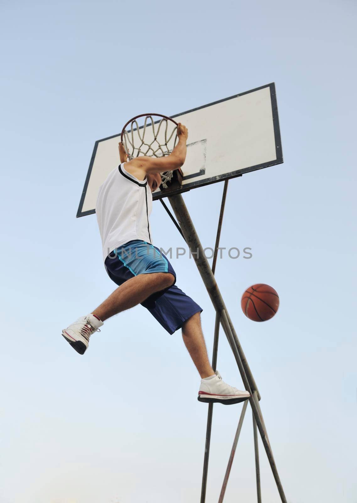 basketball player practicing and posing for basketball and sports athlete concept