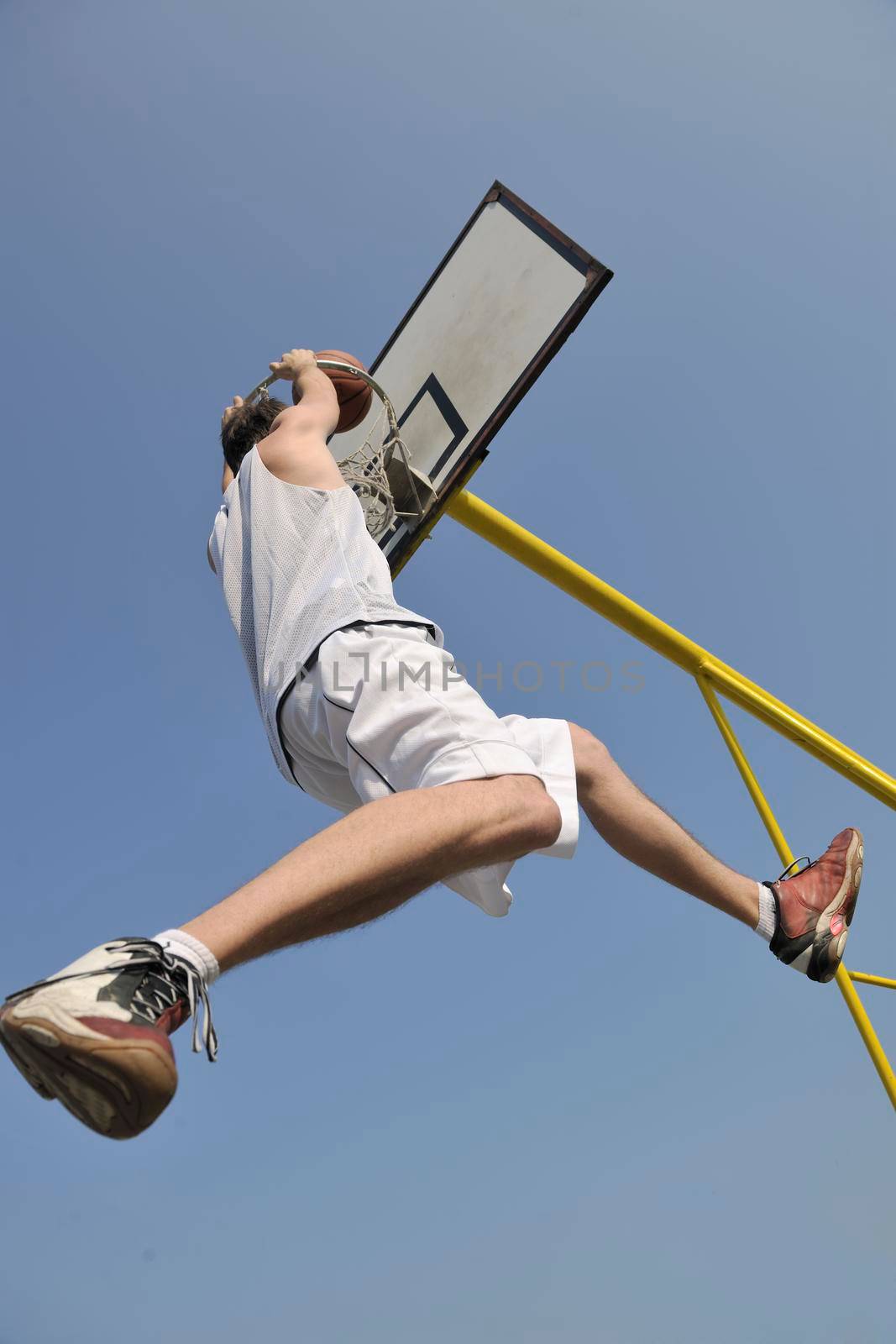 basketball player practicing and posing for basketball and sports athlete concept