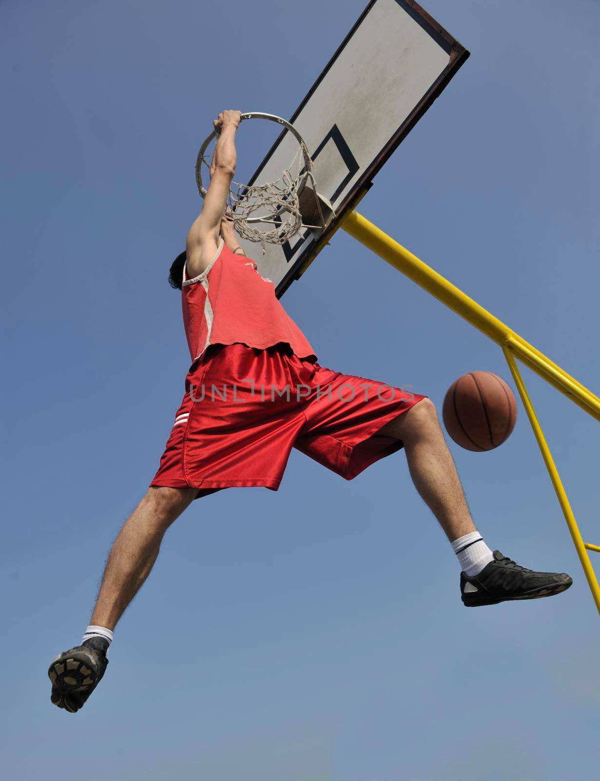 basketball player practicing and posing for basketball and sports athlete concept