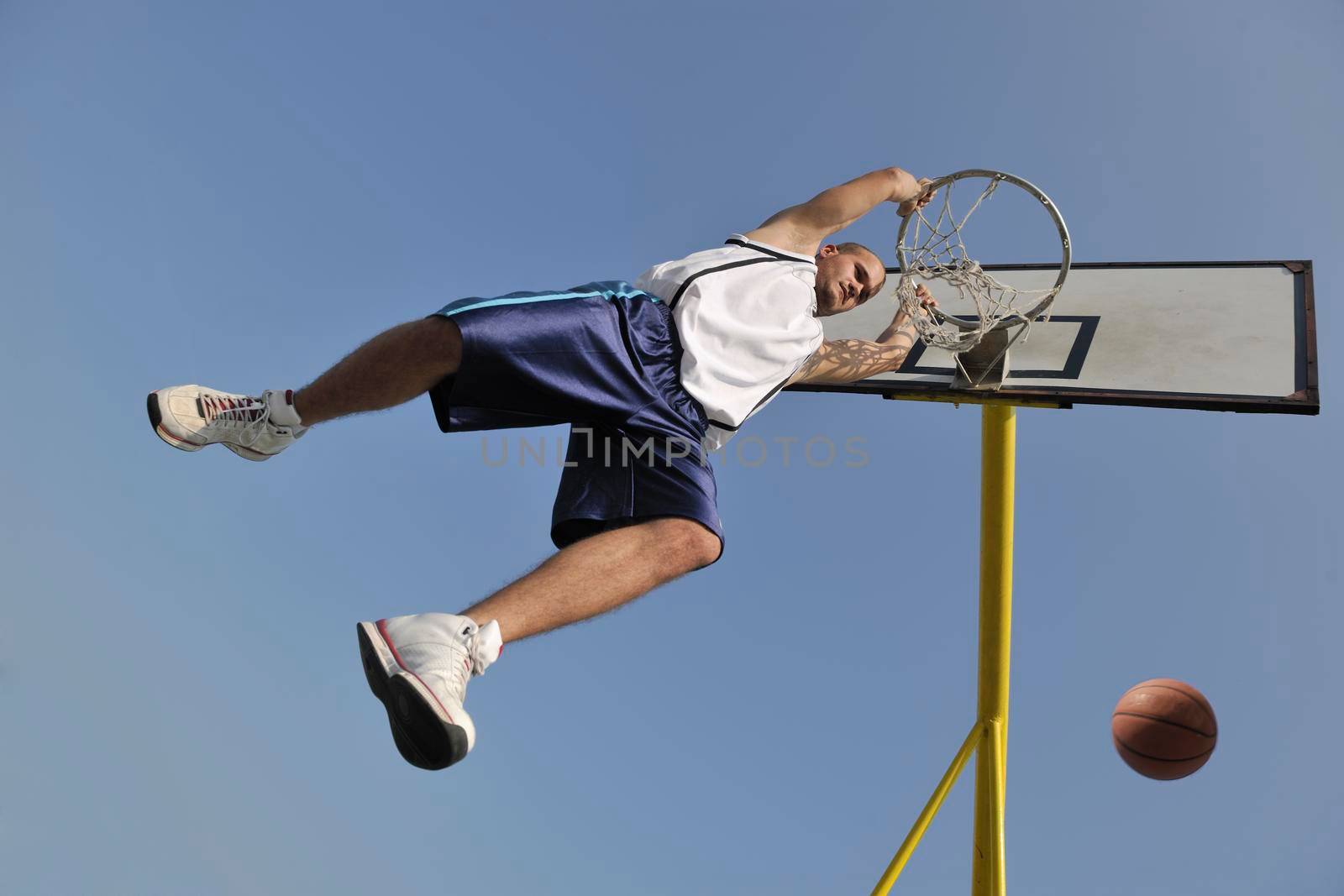 basketball player practicing and posing for basketball and sports athlete concept