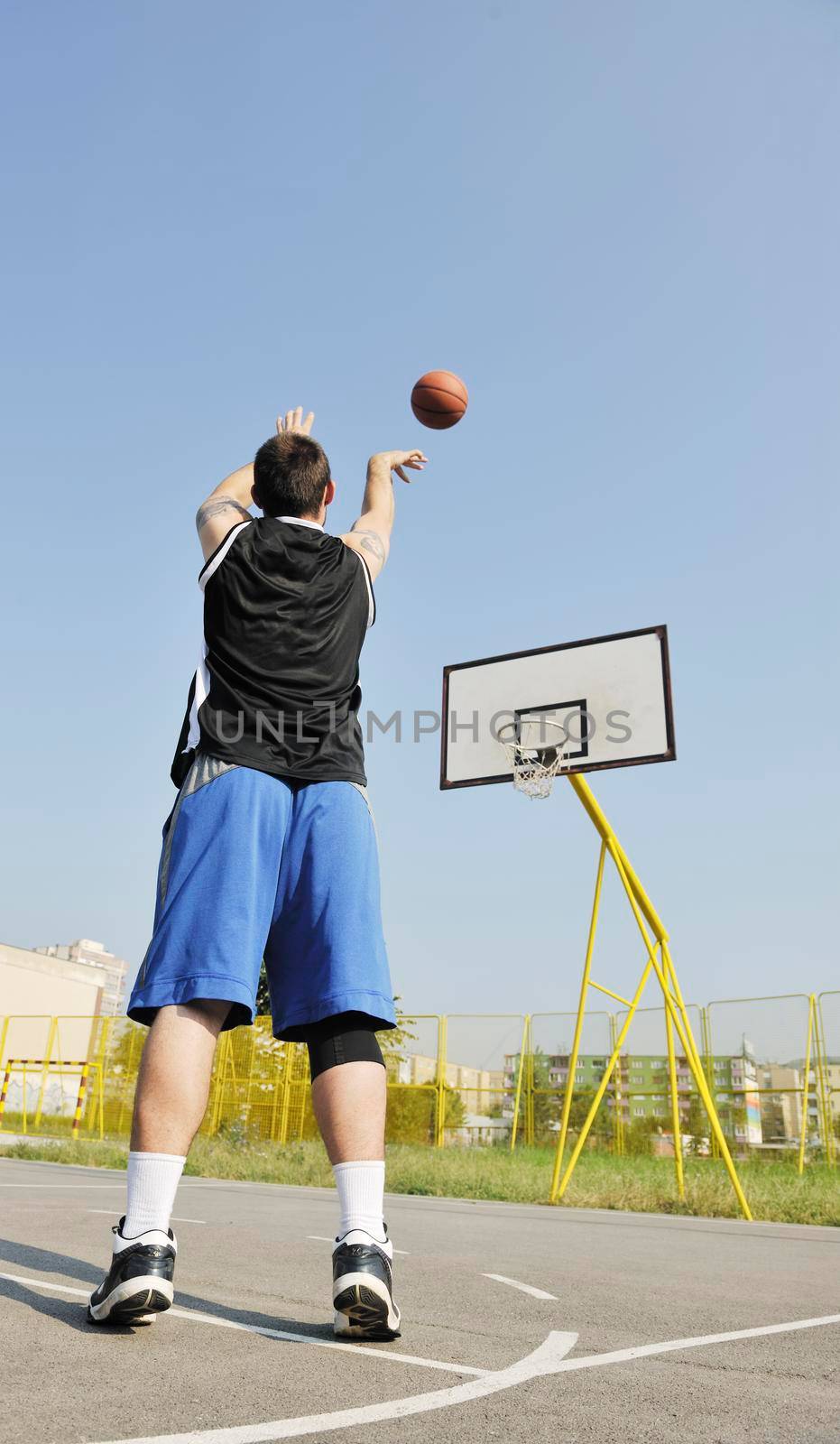 basketball player practicing and posing for basketball and sports athlete concept