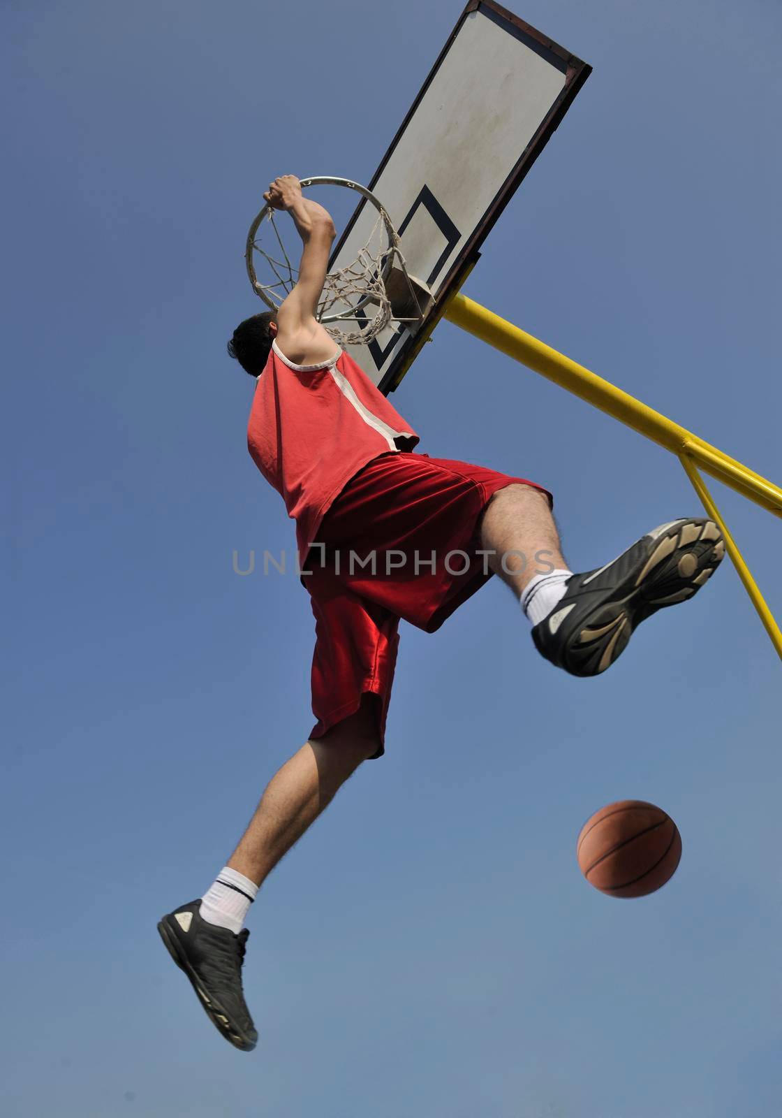 basketball player practicing and posing for basketball and sports athlete concept