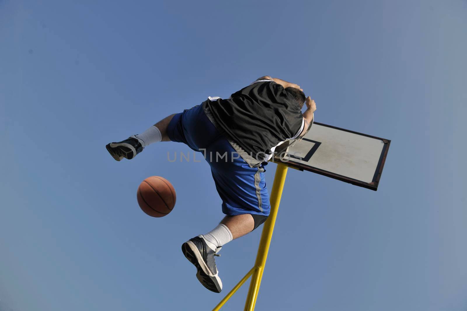 basketball player practicing and posing for basketball and sports athlete concept