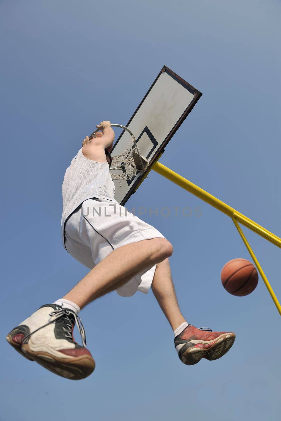 basketball player practicing and posing for basketball and sports athlete concept