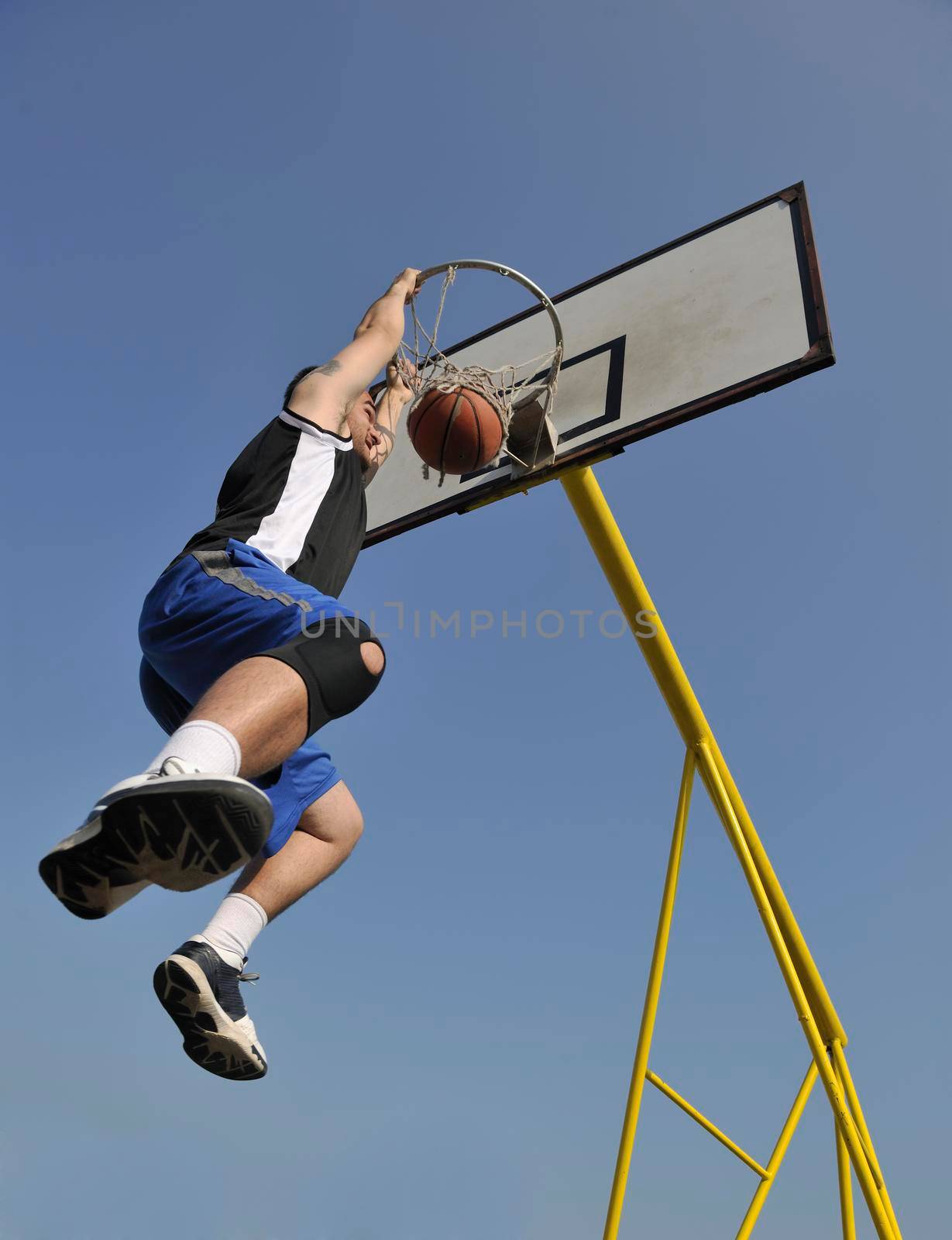 basketball player practicing and posing for basketball and sports athlete concept