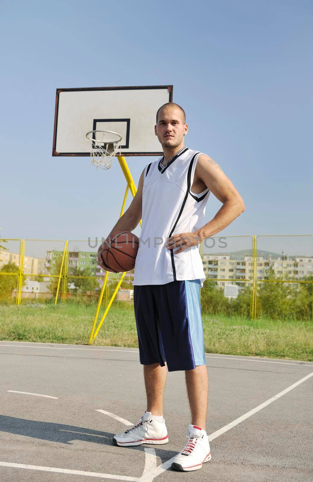 basketball player practicing and posing for basketball and sports athlete concept