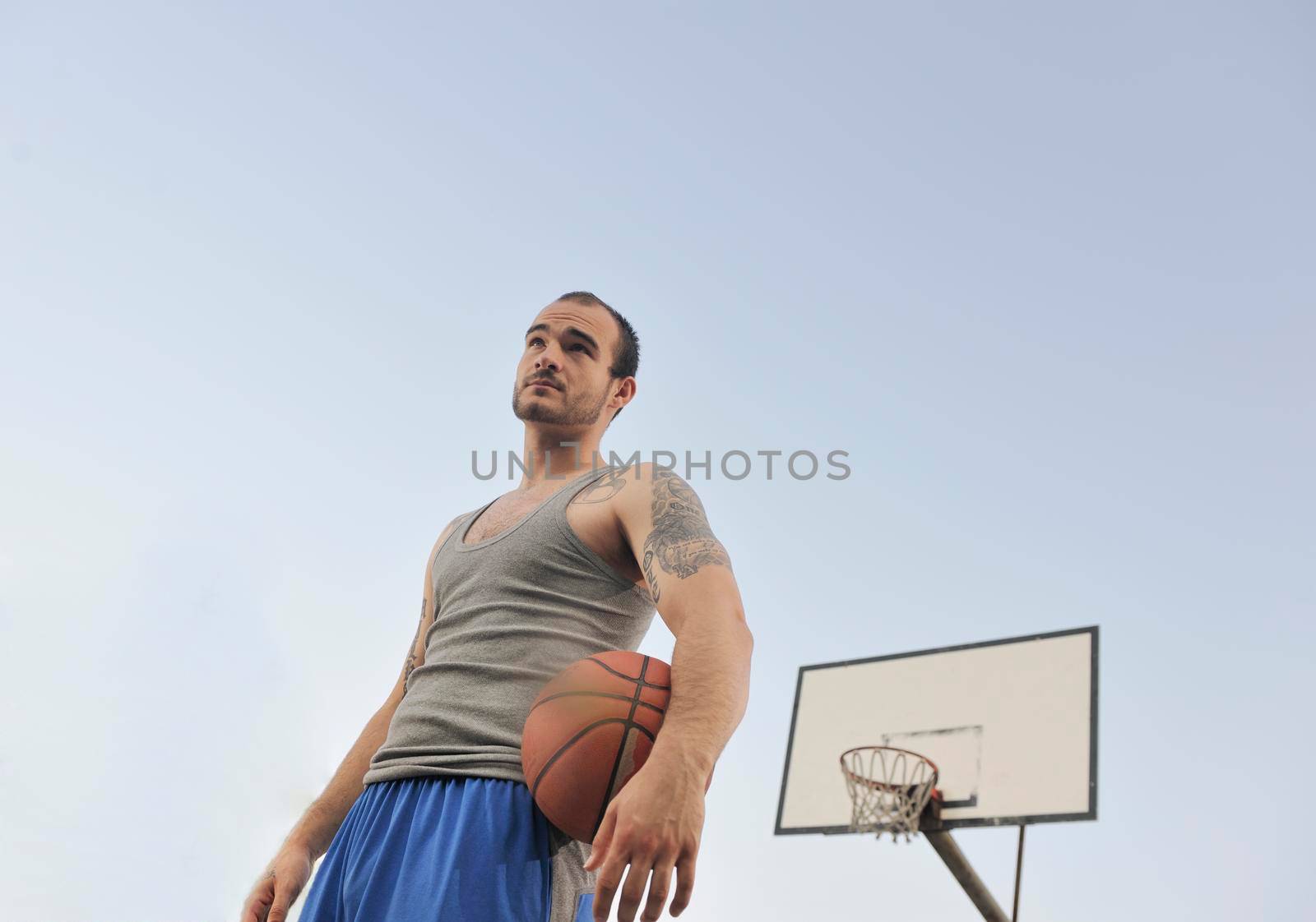 basketball player practicing and posing for basketball and sports athlete concept