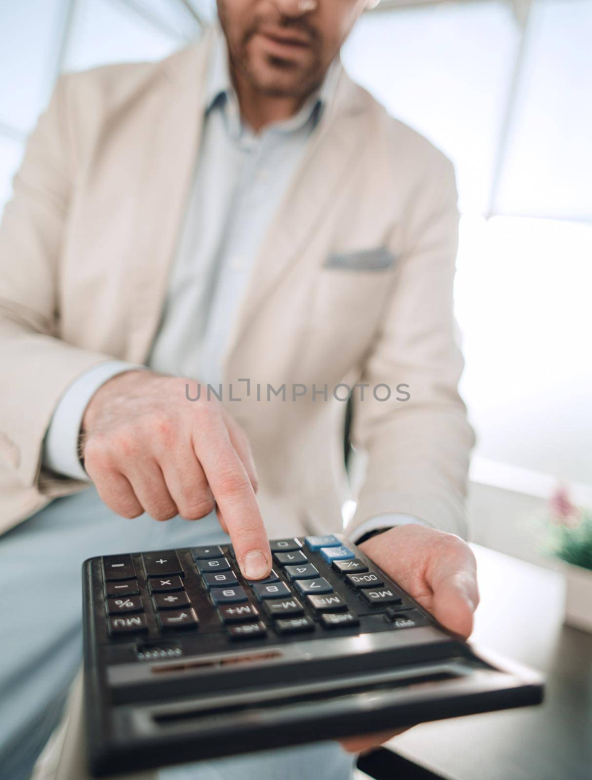 close up. businessman with calculator.business concept