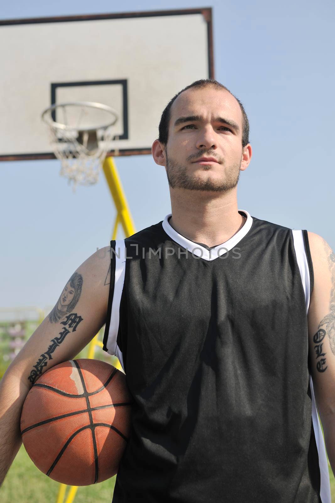 basketball player practicing and posing for basketball and sports athlete concept