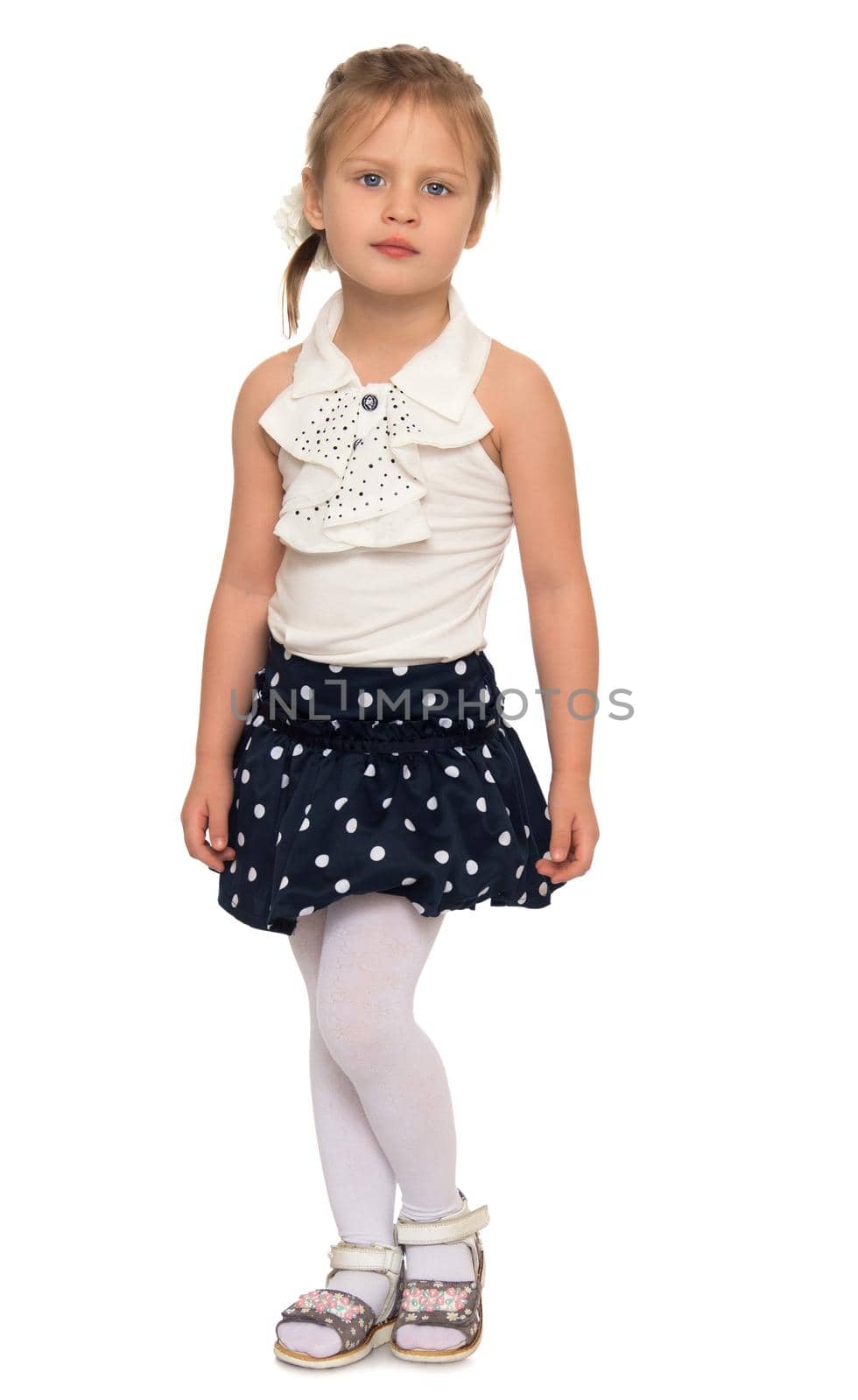 Portrait of beautiful little girl in the short polka-dot skirt - Isolated on white background