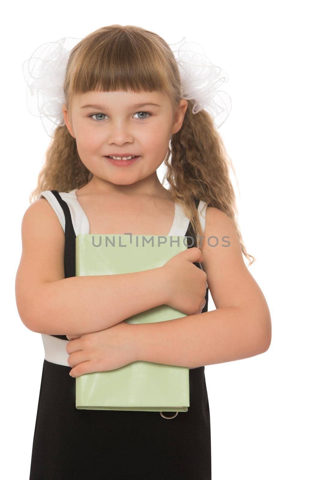 Honey girl school girl in a black dress with a book in his hands. With a white bow on her head. Close-up - Isolated on white background