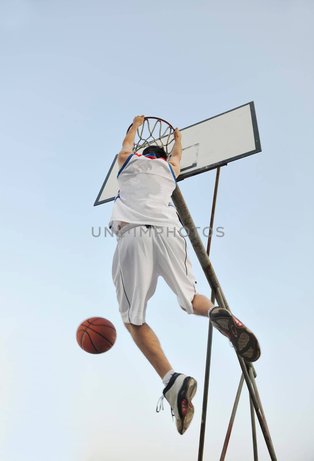 basketball player practicing and posing for basketball and sports athlete concept