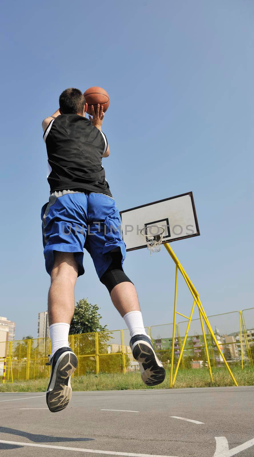 basketball player practicing and posing for basketball and sports athlete concept