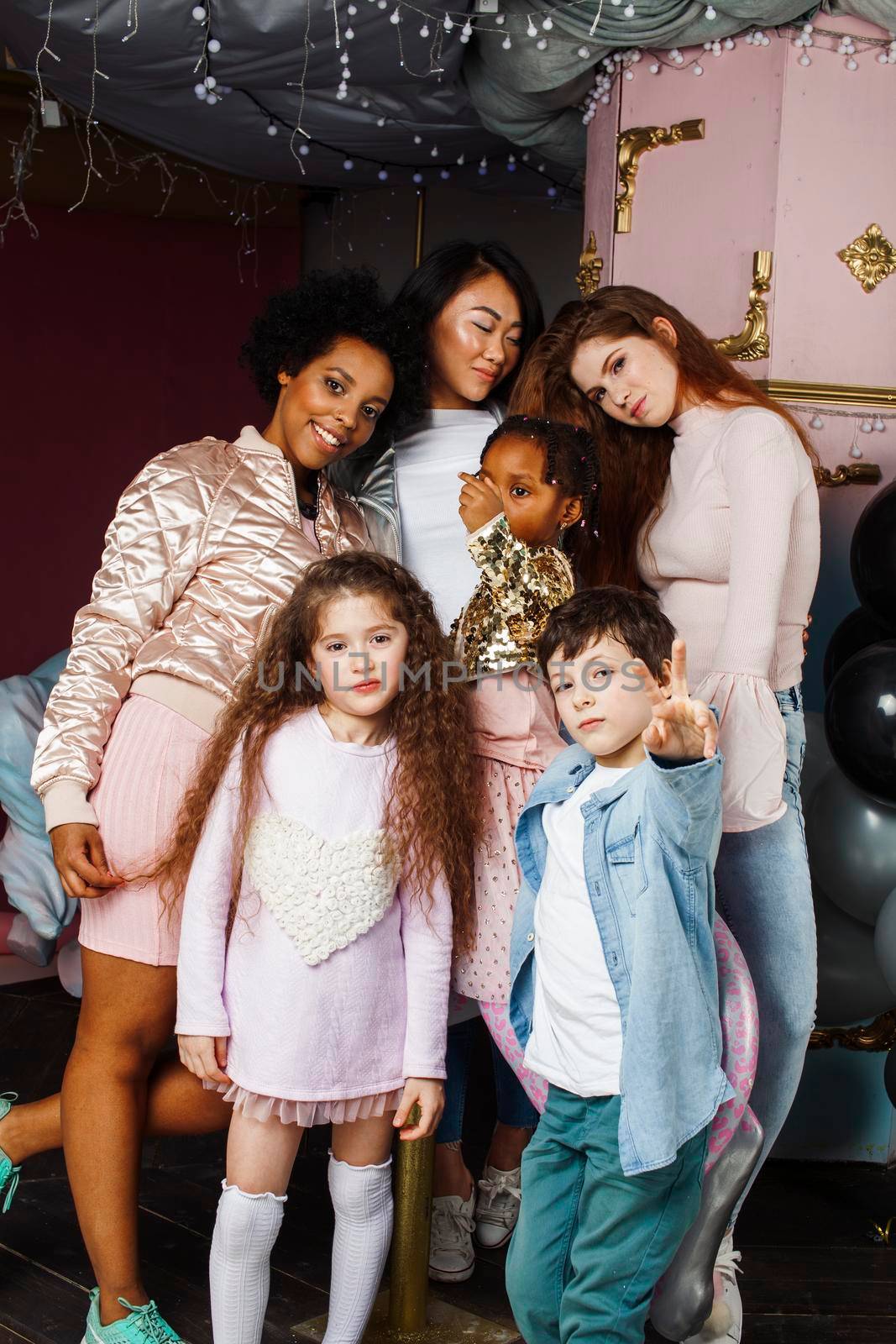 Lifestyle and people concept: young diversity nations woman with different age children celebrating on birthday party together happy, making selfie. African-american, asian and caucasian by JordanJ
