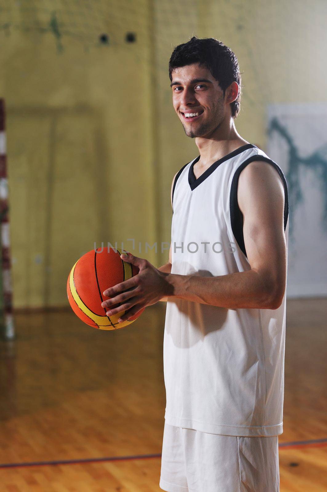 basket ball game player at sport hall by dotshock