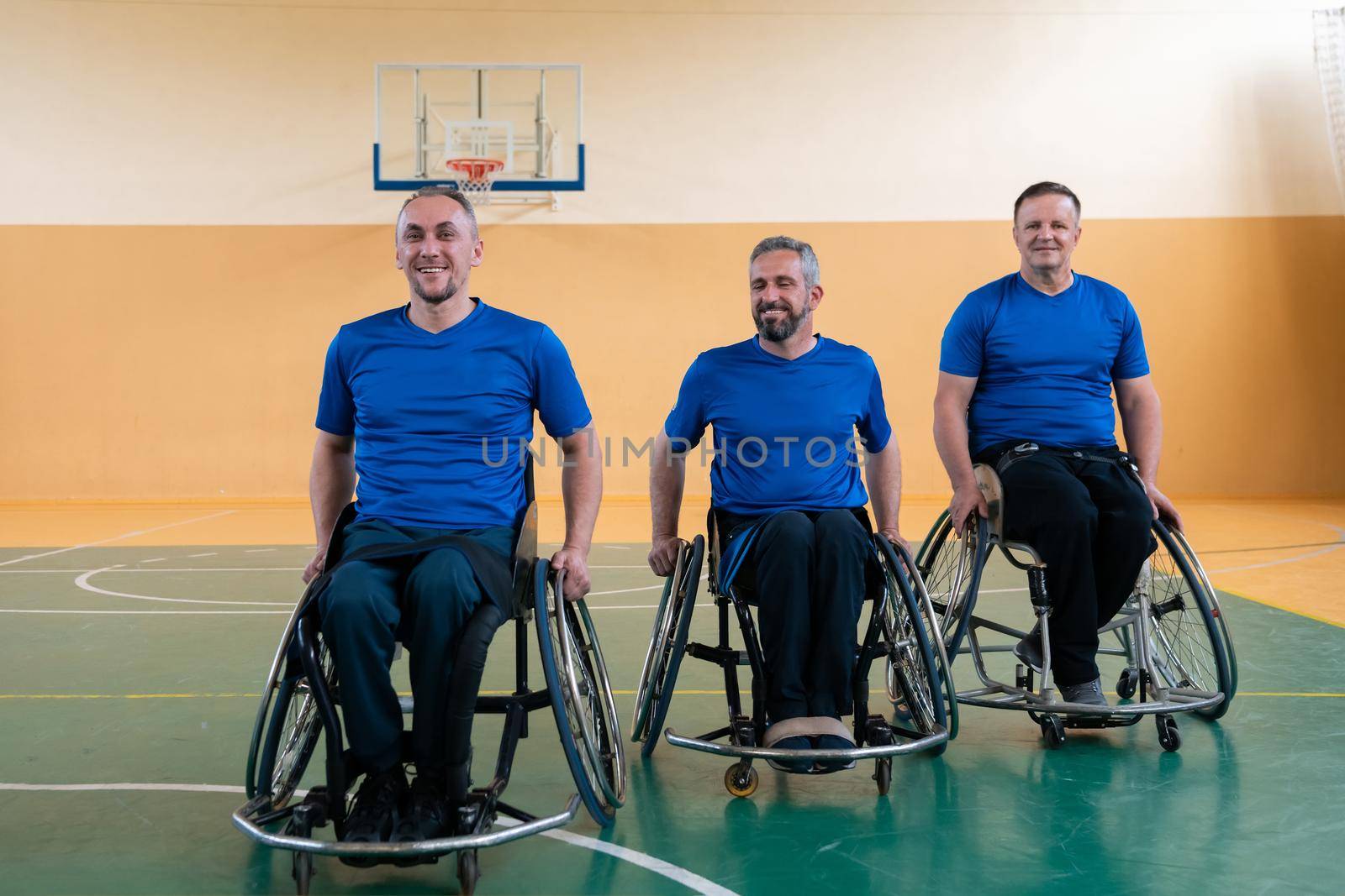  photo of the basketball team of war invalids with professional sports equipment for people with disabilities on the basketball court. High quality photo