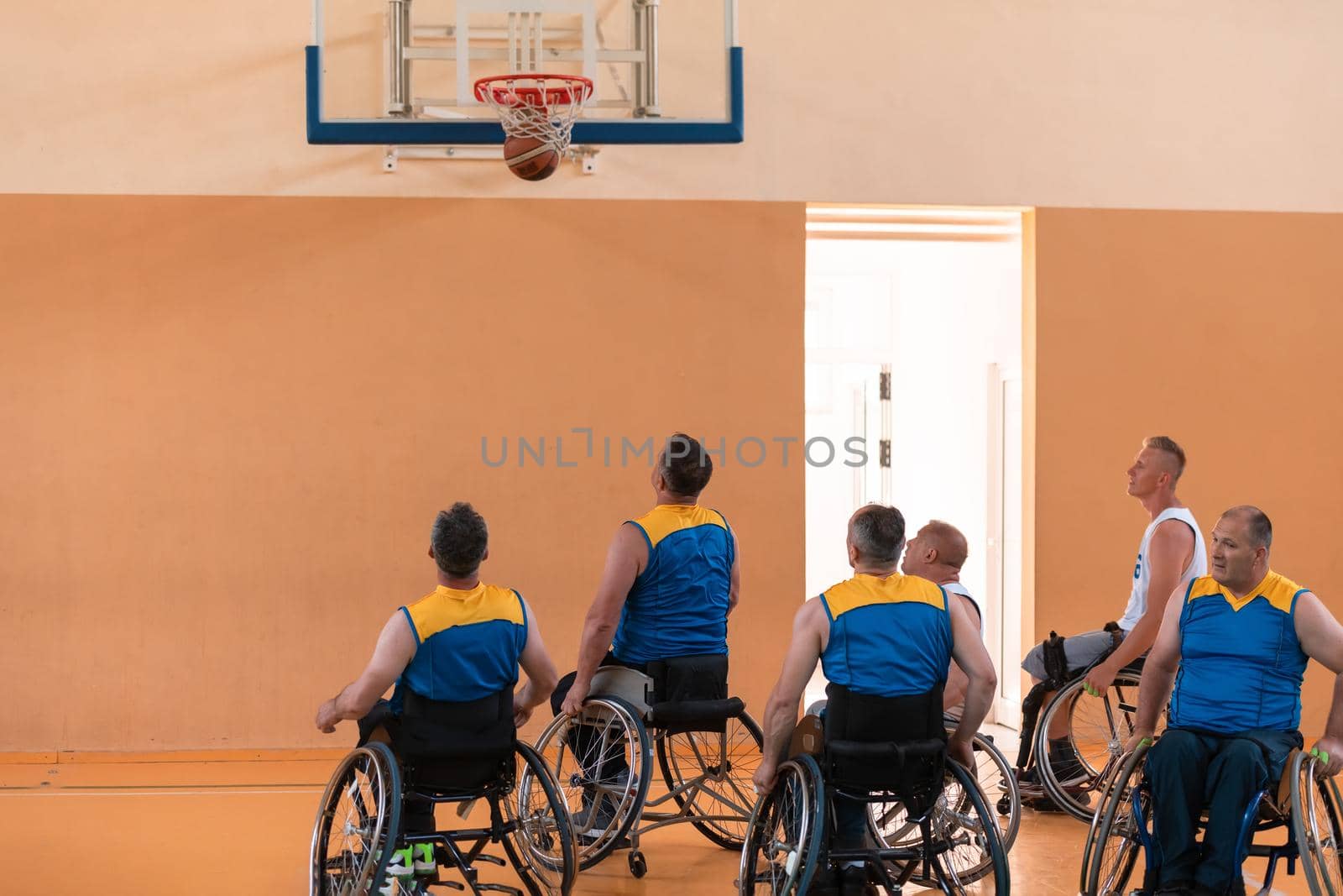 a photo of basketball teams with disabilities with the selector in the big hall before the start of the basketball game by dotshock