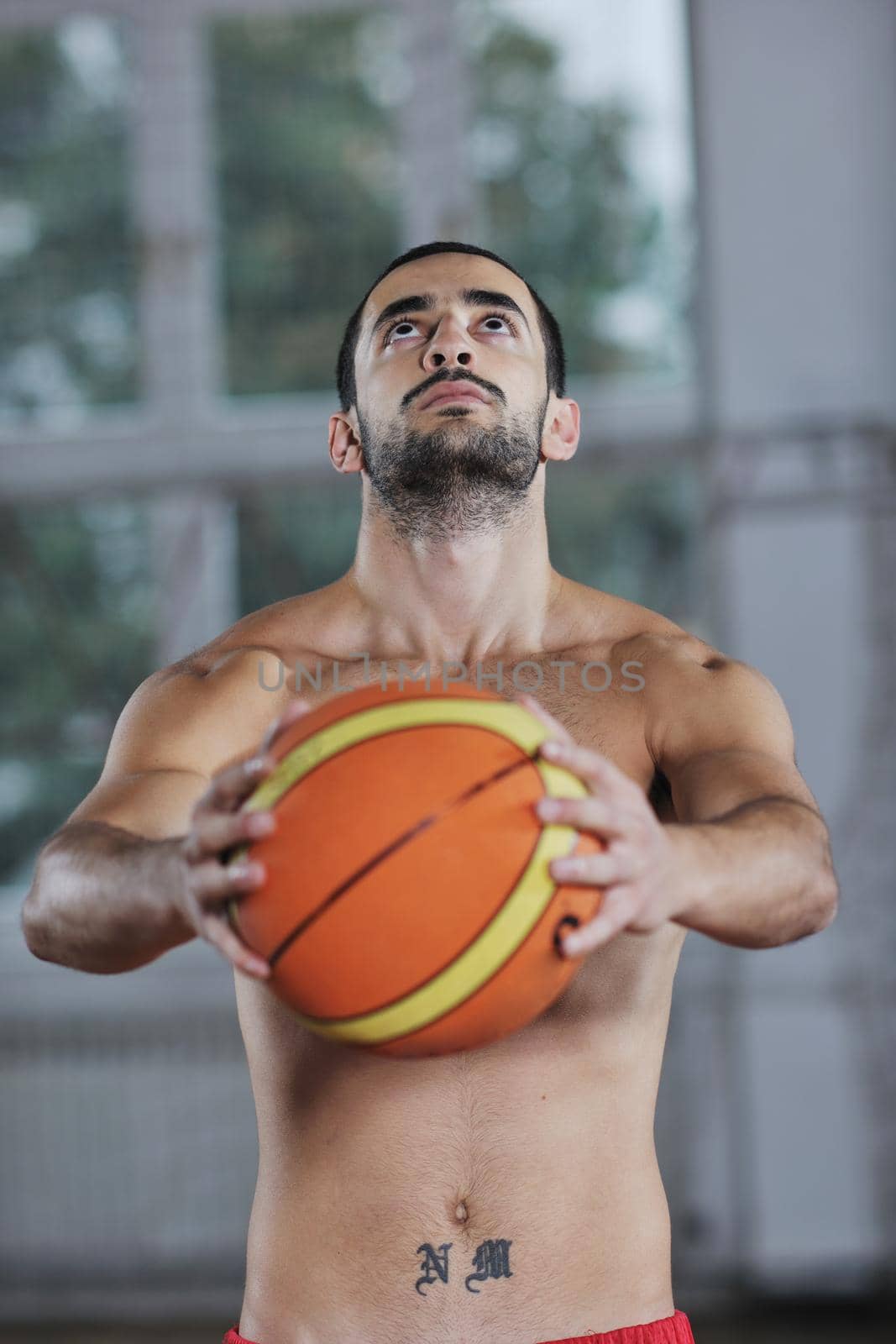 young and healthy people man have recreation and training exercise  while play basketball game at sport gym indoor hall