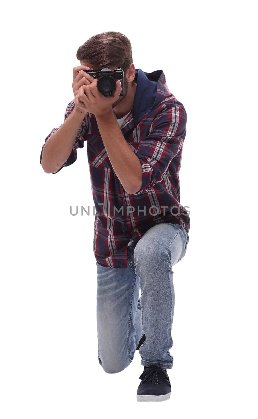 full-length . young man photographer with camera.isolated on white background