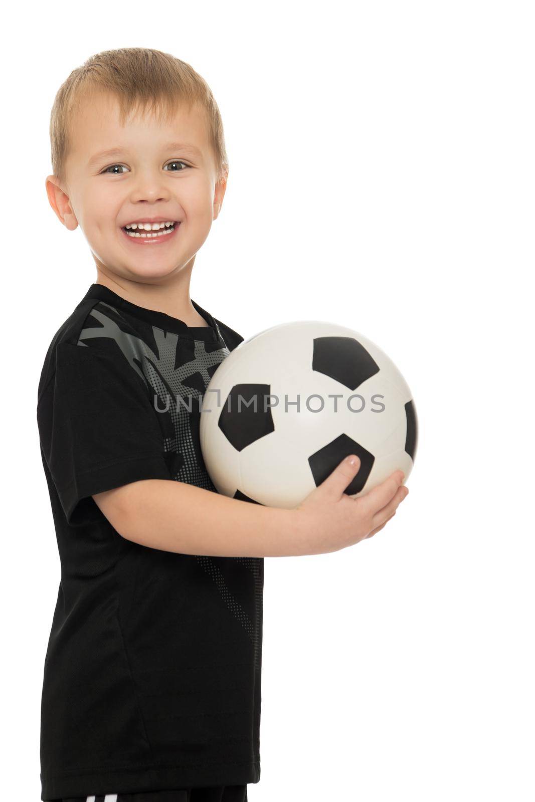 Little boy with soccer ball by kolesnikov_studio