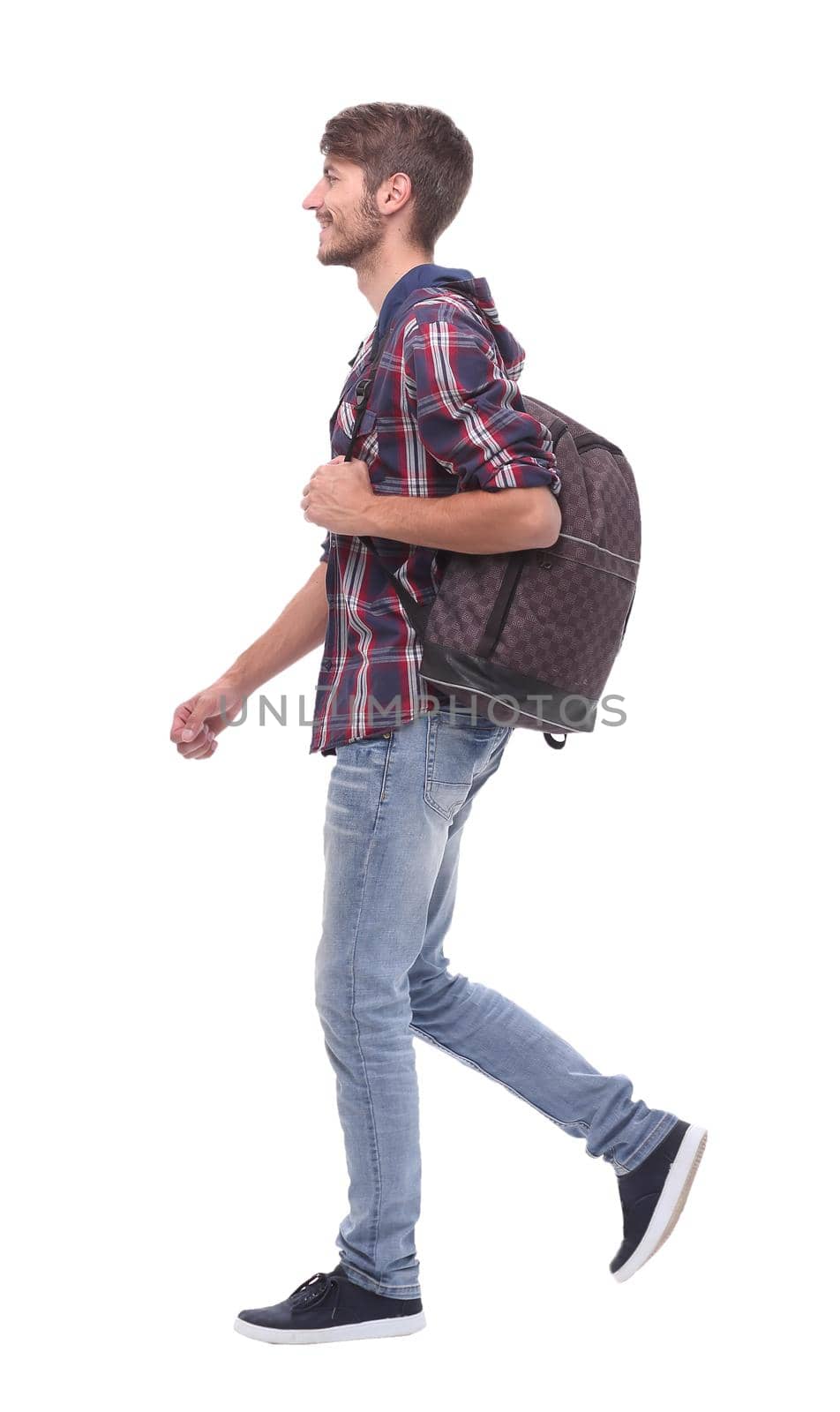 in full growth. a handsome male student steps forward.isolated on white background.