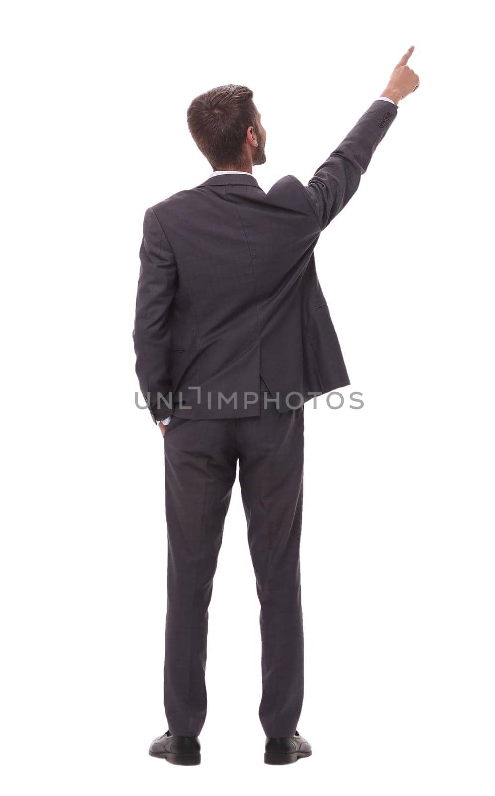 rear view. young businessman pointing to copy space by asdf