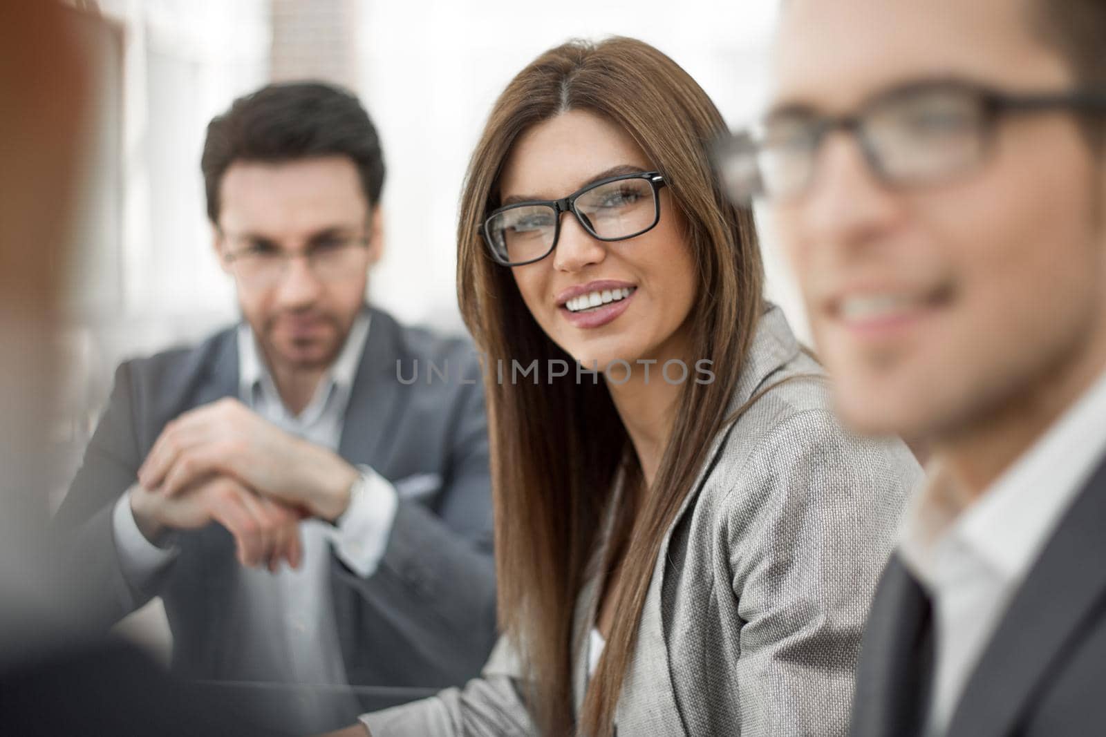 close up.successful business woman on the background of her colleagues.business people