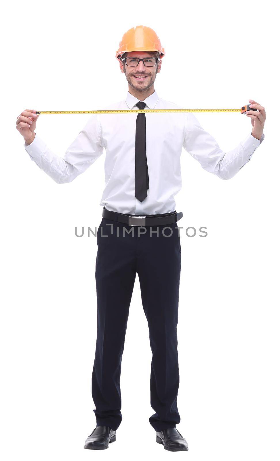 in full growth. young architect with yellow tape measure. isolated on white background