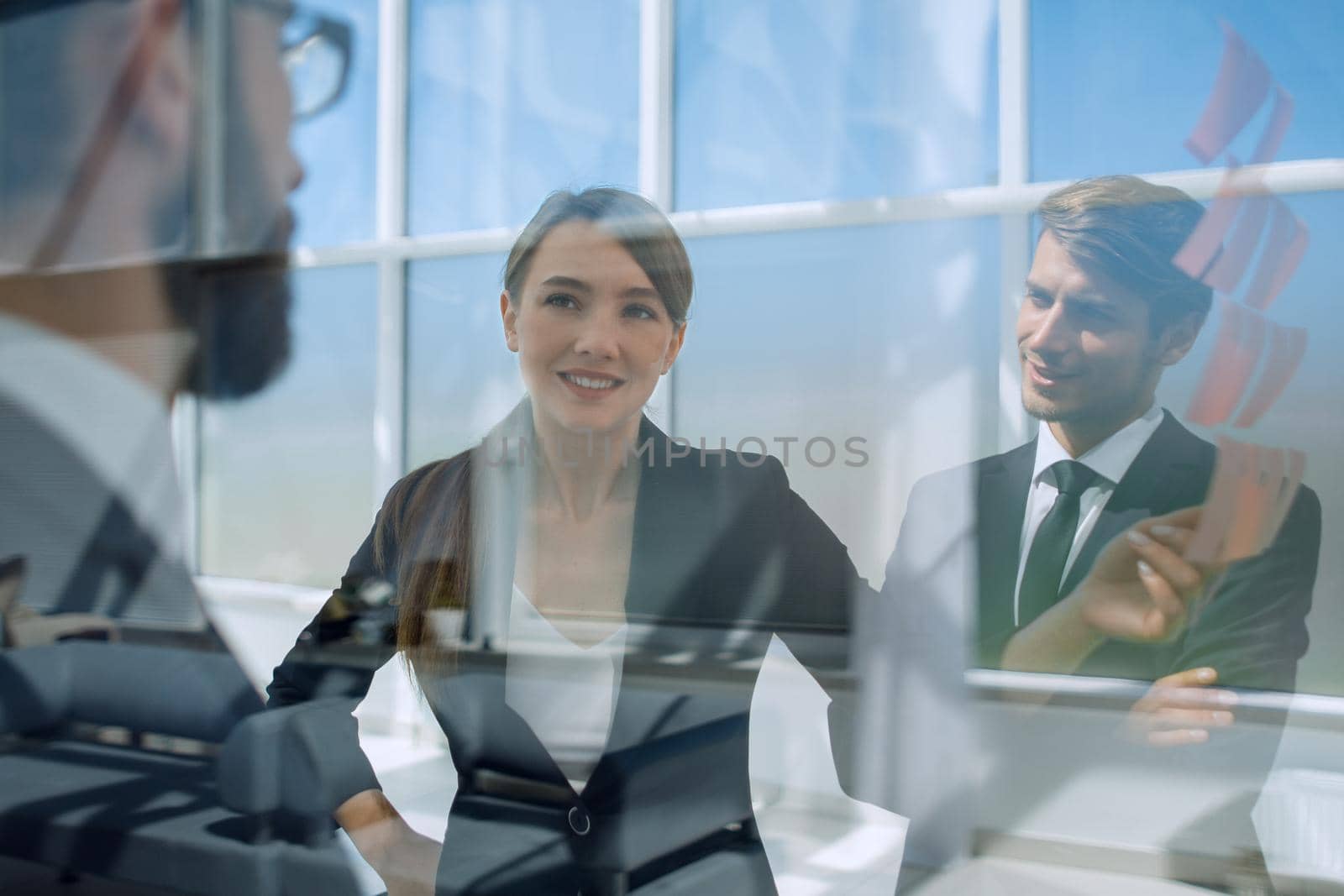 close up.employees on the background of a modern office.business concept