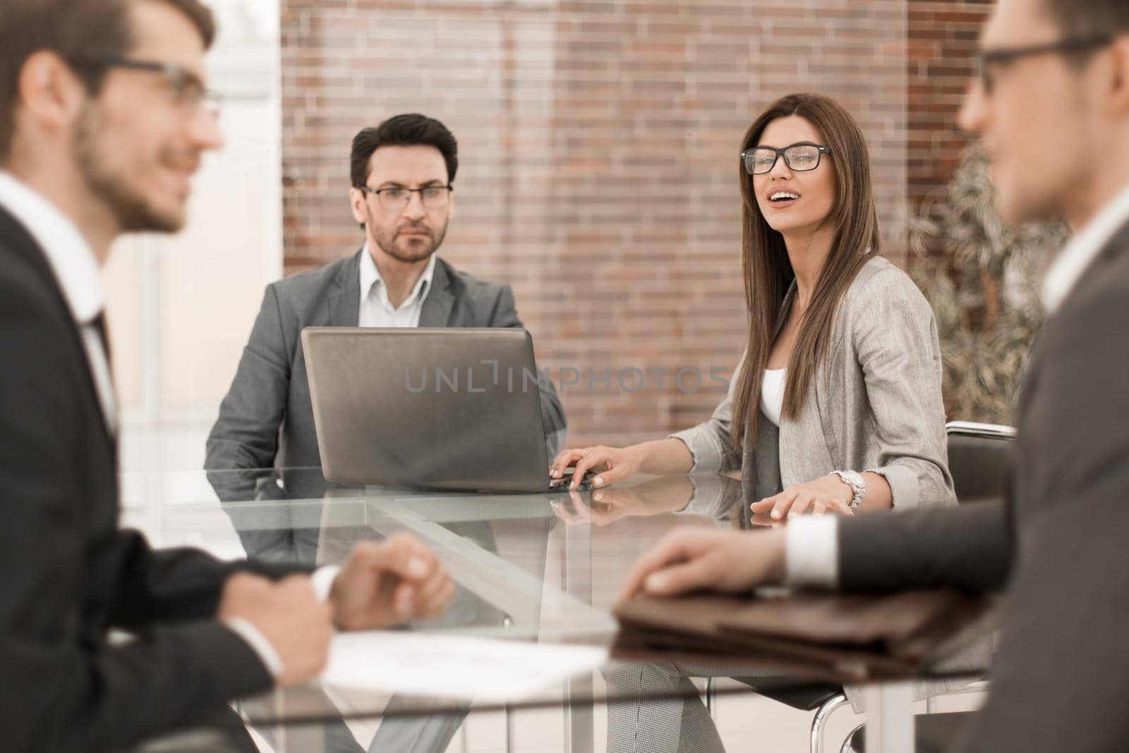business partners talk sitting at the office table.business concept