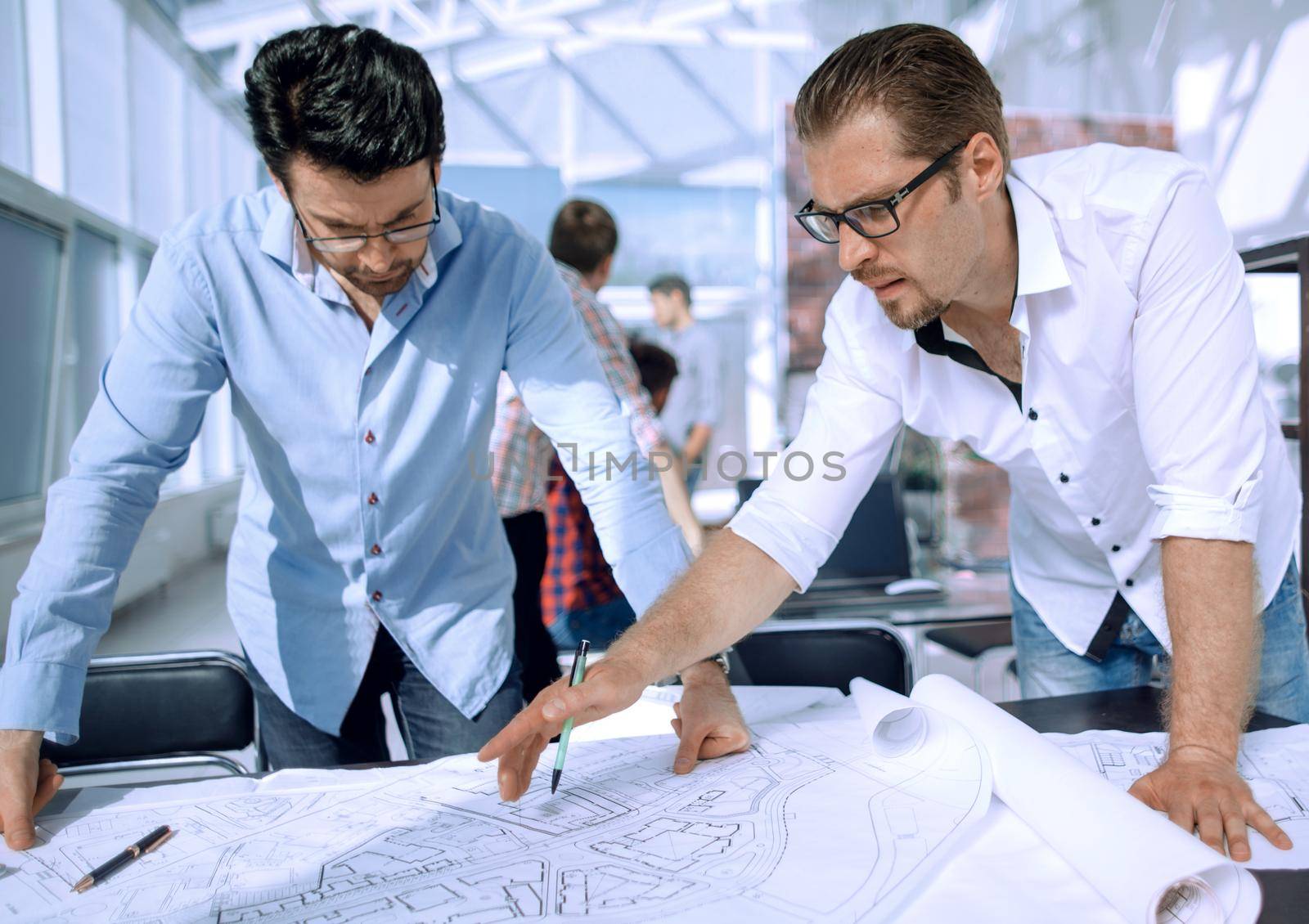 landscape designers discussing new sketches .the concept of professionalism