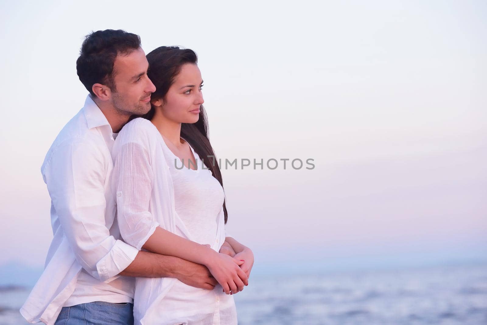 young couple  on beach have fun by dotshock